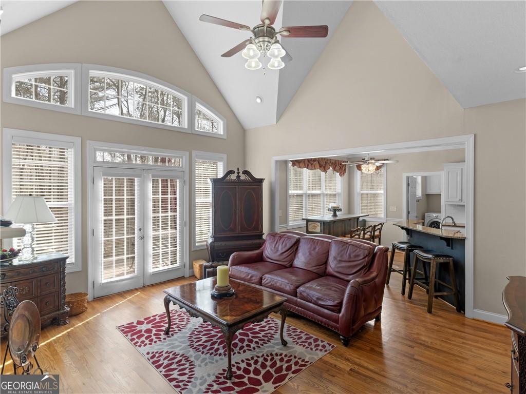 355 Parker Road Covington, GA 30014 - Photo 21 of 60 a living room with furniture ceiling fan and a rug