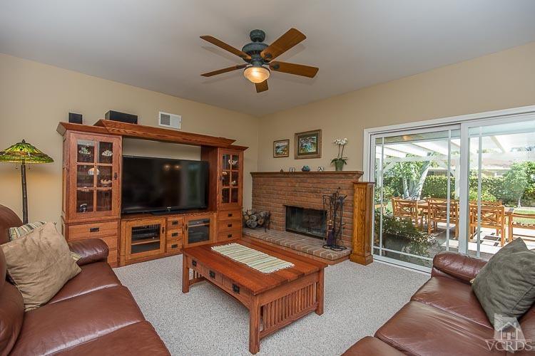 681 Rancho Road Thousand Oaks, CA 91362 - Photo 14 of 45 a living room with furniture a flat screen tv and a fireplace