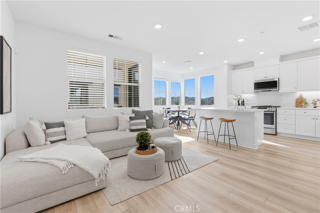 1300 Lasso Way, Unit 305 Rancho Mission Viejo, CA 92694 - Photo 1 of 75 a living room with furniture and view of kitchen
