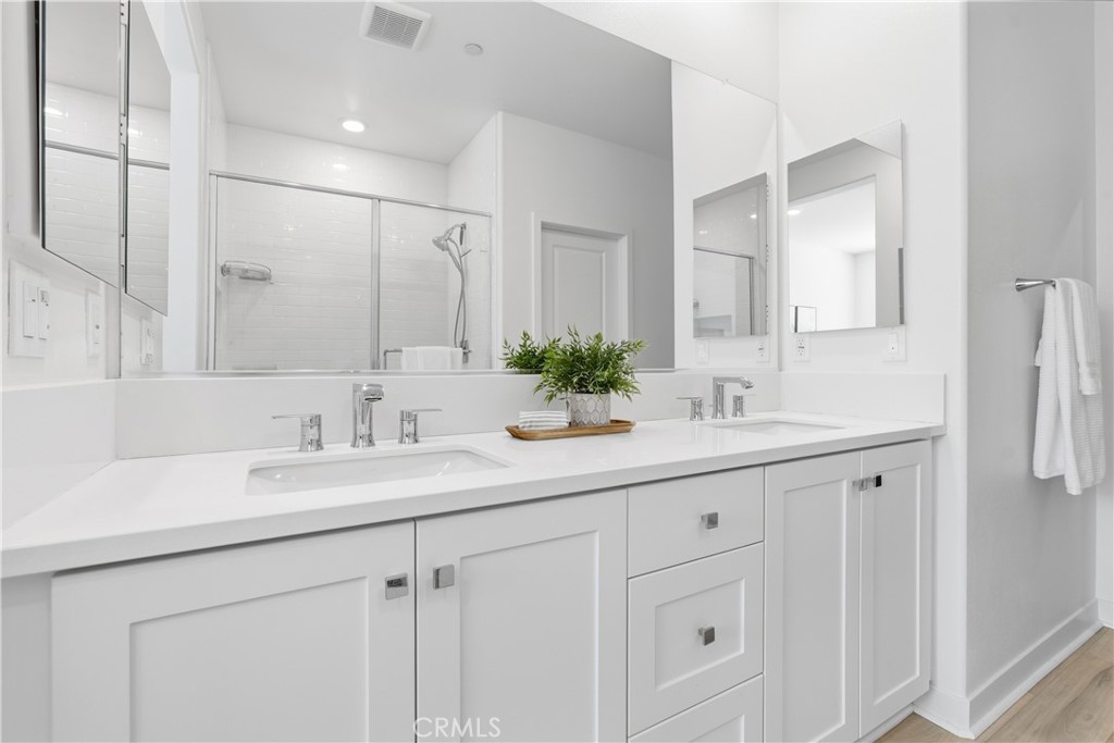 1300 Lasso Way, Unit 305 Rancho Mission Viejo, CA 92694 - Photo 18 of 75 a bathroom with double sink and a mirror