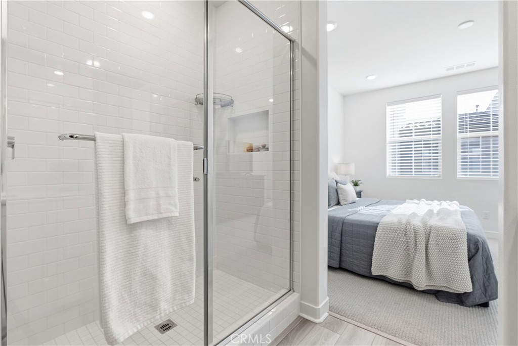 1300 Lasso Way, Unit 305 Rancho Mission Viejo, CA 92694 - Photo 20 of 75 a room with a bed and a mirror