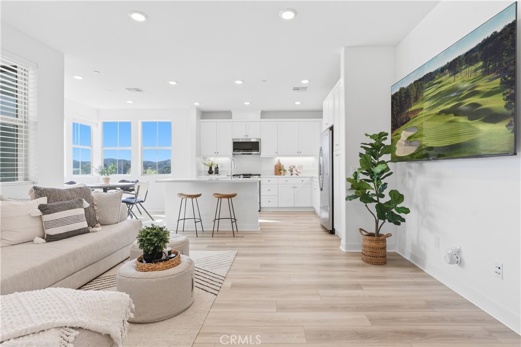 1300 Lasso Way, Unit 305 Rancho Mission Viejo, CA 92694 - Photo 2 of 75 a living room with furniture and flowers