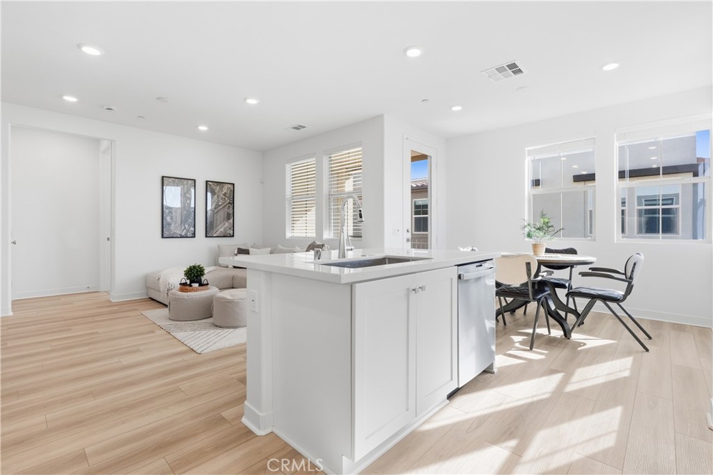 1300 Lasso Way, Unit 305 Rancho Mission Viejo, CA 92694 - Photo 7 of 75 a very nice looking room with a large window and furniture