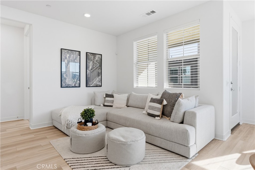 1300 Lasso Way, Unit 305 Rancho Mission Viejo, CA 92694 - Photo 10 of 75 a living room with furniture and a window