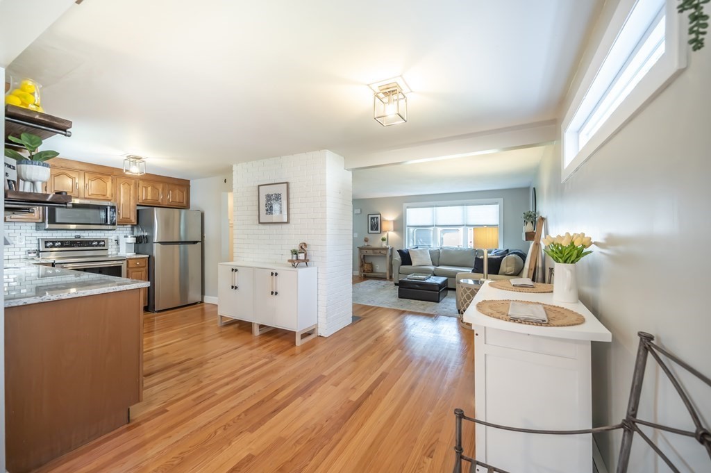15 Anna Road Woburn, MA 01801 - Photo 11 of 28 a room with stainless steel appliances wooden floors and kitchen view