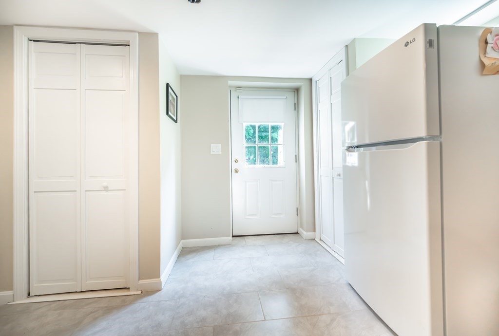 15 Anna Road Woburn, MA 01801 - Photo 24 of 28 a view of a kitchen with a refrigerator and a refrigerator