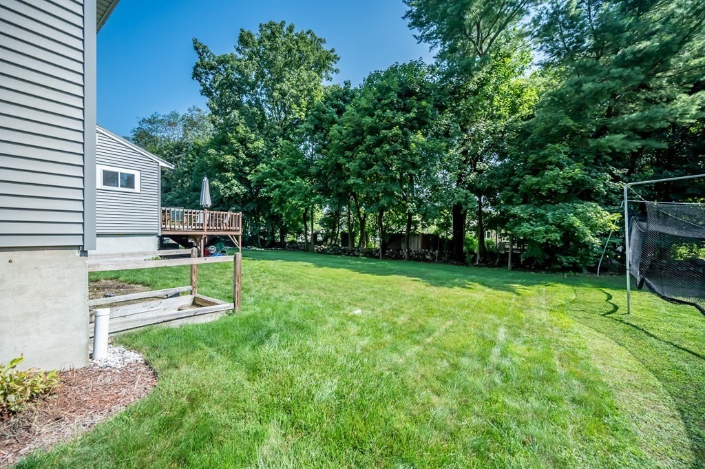 15 Anna Road Woburn, MA 01801 - Photo 28 of 28 a view of a chair and table in the garden