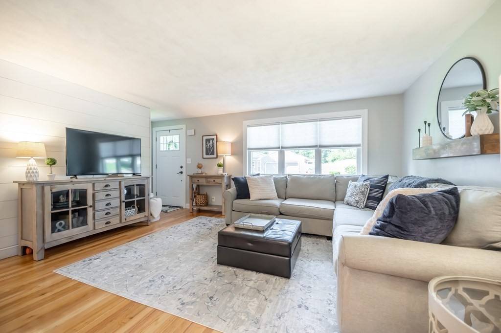 15 Anna Road Woburn, MA 01801 - Photo 5 of 28 a living room with furniture and a flat screen tv