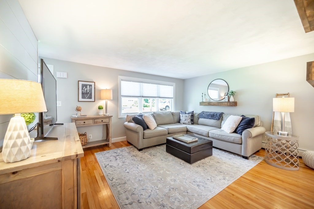 15 Anna Road Woburn, MA 01801 - Photo 6 of 28 a living room with furniture and a large window