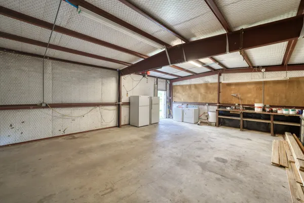 a front view of house with yard and trees