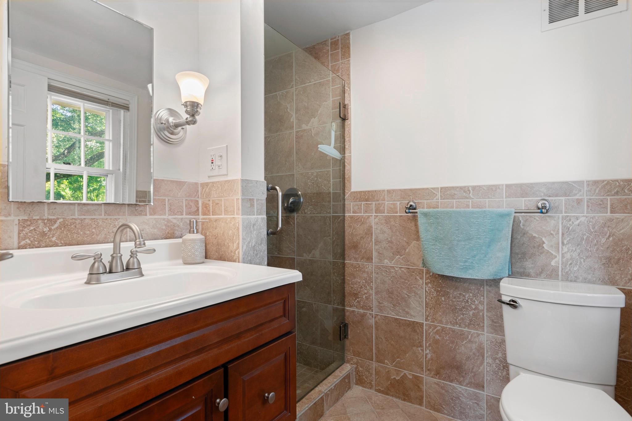 5020 Dermond Road Drexel Hill, PA 19026 - Photo 28 of 39 a bathroom with a sink mirror vanity and toilet
