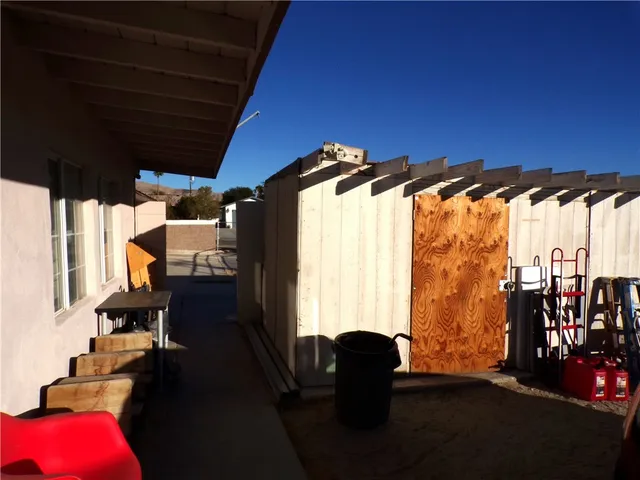 a view of living room with furniture and floor to ceiling window
