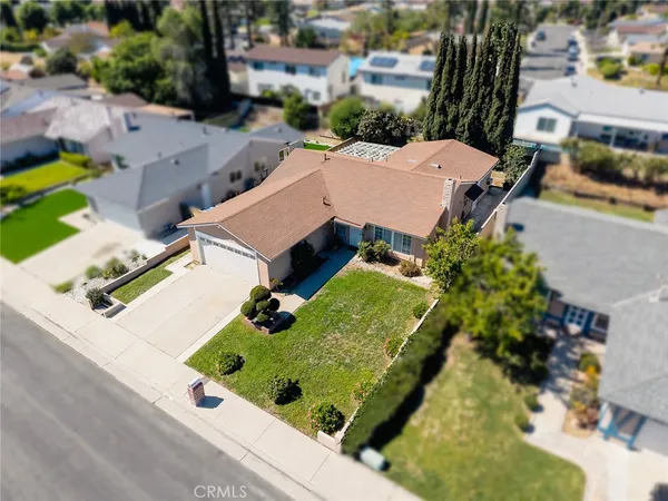 an aerial view of a house with a garden