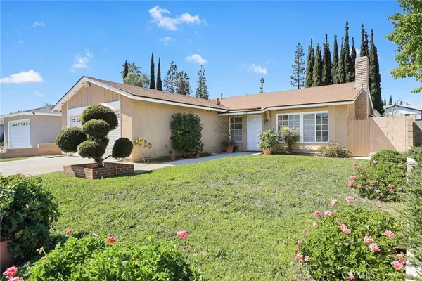 a house view with a garden space