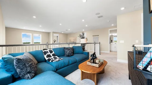 a view of a swimming pool with a patio and plants