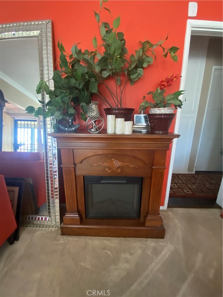 2737 West Caldwell Street Compton, CA 90220 - Photo 12 of 12 a fireplace with a clock on top of it