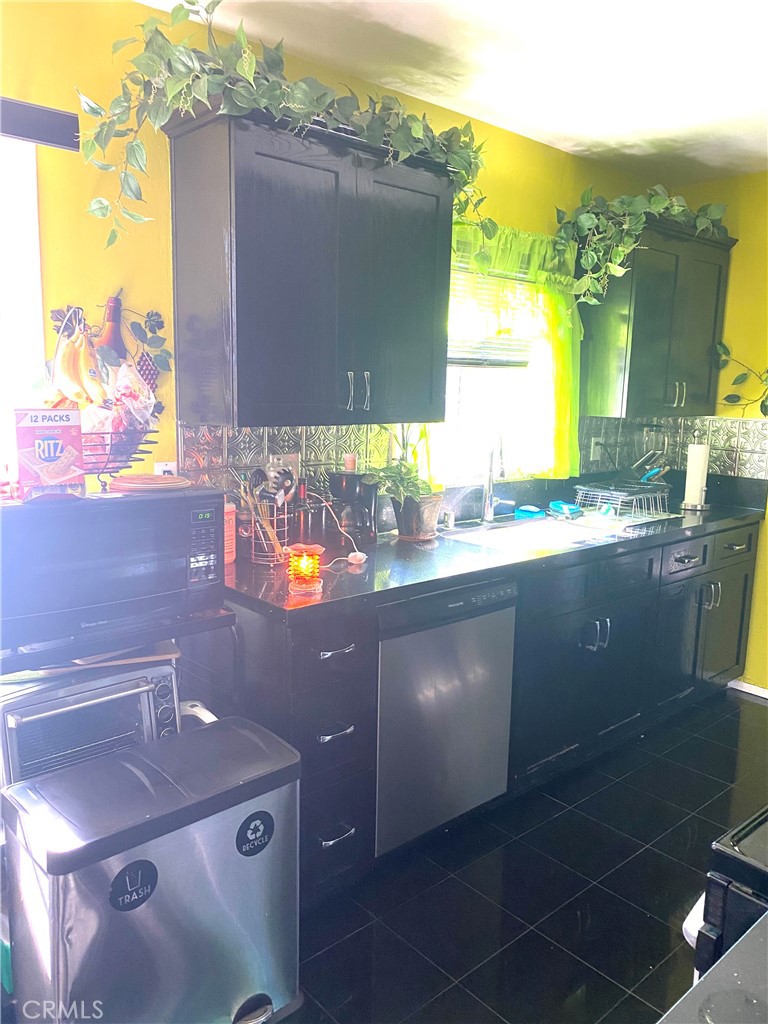 2737 West Caldwell Street Compton, CA 90220 - Photo 10 of 12 a bathroom with a sink and a mirror
