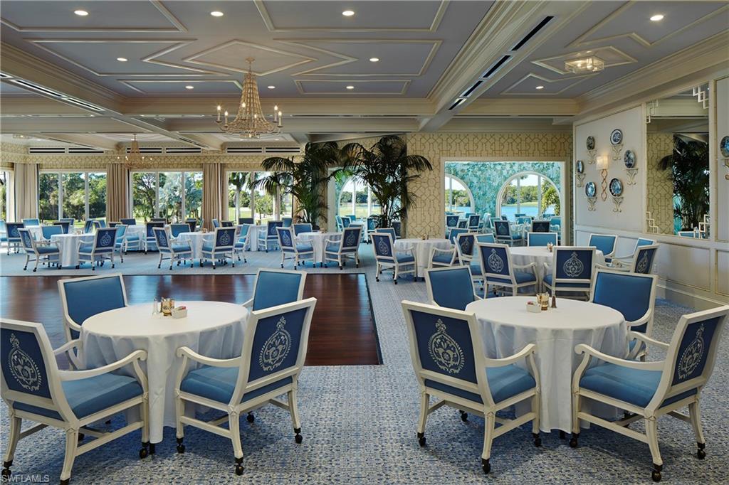 258 Audubon Boulevard Naples, FL 34110 - Photo 16 of 30 a dining area with a large window and chairs