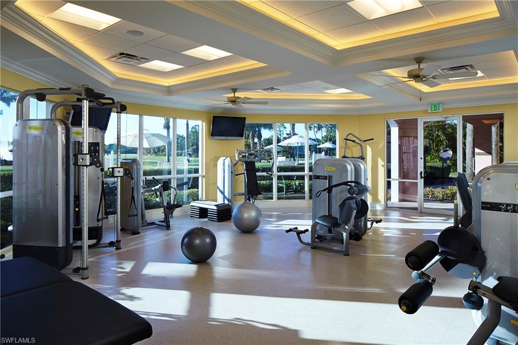 258 Audubon Boulevard Naples, FL 34110 - Photo 19 of 30 a room with gym equipment and a large window