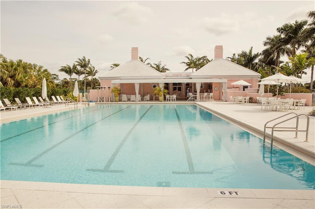 258 Audubon Boulevard Naples, FL 34110 - Photo 23 of 30 a view of a white house with a yard