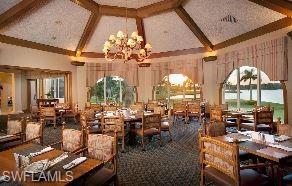 258 Audubon Boulevard Naples, FL 34110 - Photo 25 of 30 a very nice looking living room with a large window