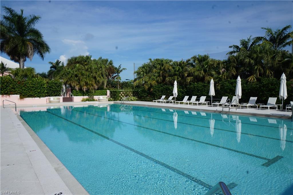 258 Audubon Boulevard Naples, FL 34110 - Photo 28 of 30 a view of swimming pool with outdoor seating and green space