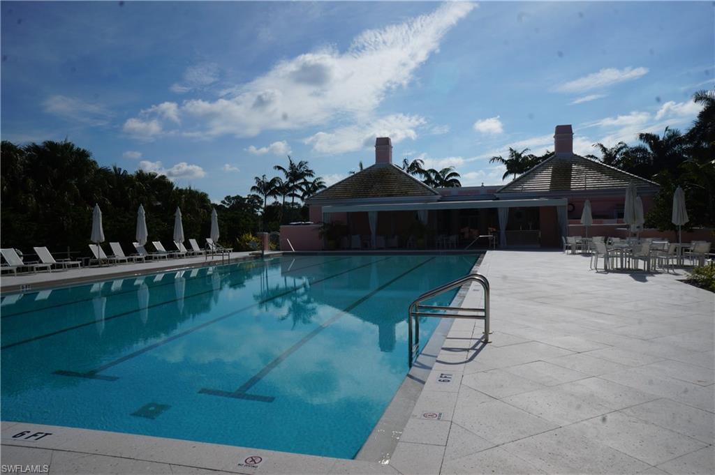 258 Audubon Boulevard Naples, FL 34110 - Photo 29 of 30 a view of a swimming pool with a patio and plants