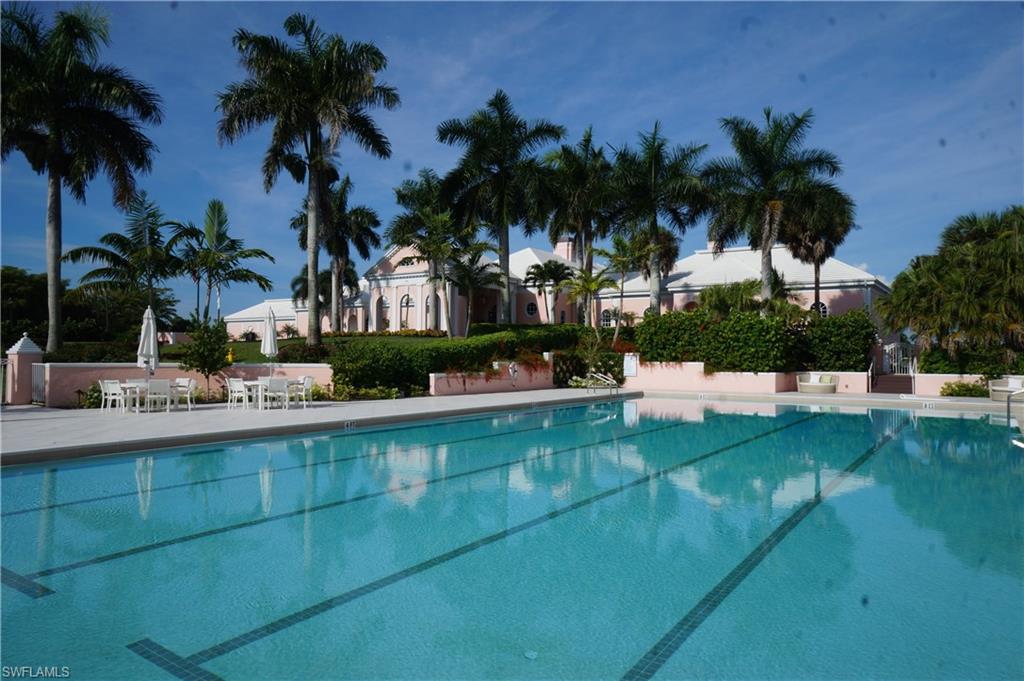 258 Audubon Boulevard Naples, FL 34110 - Photo 30 of 30 a view of a swimming pool and a chair