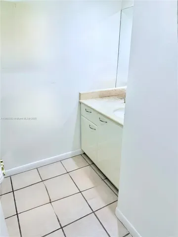 a bedroom with bed and wooden floor