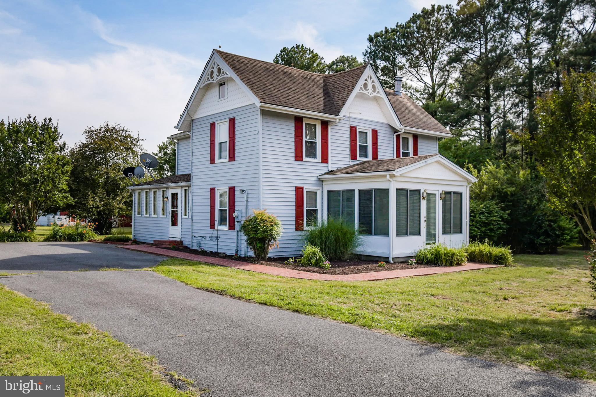 10826 Brownstone Road Princess Anne, MD 21853 - Photo 2 of 68 a front view of a house with a yard and garage