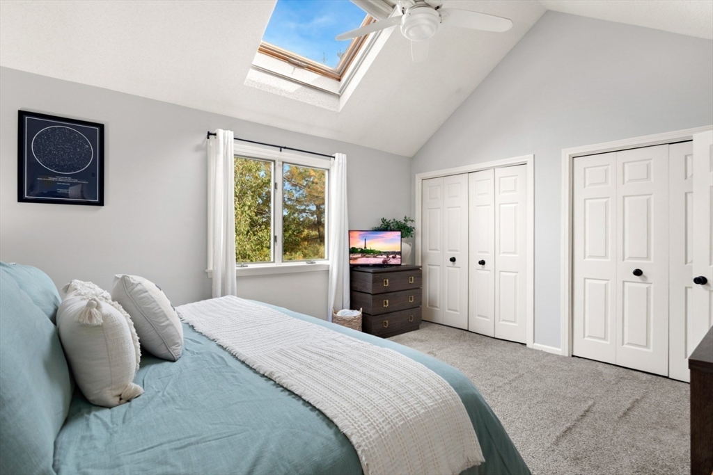 108 Abington Road, Unit 108 Danvers, MA 01923 - Photo 17 of 34 a bedroom with a bed and a television