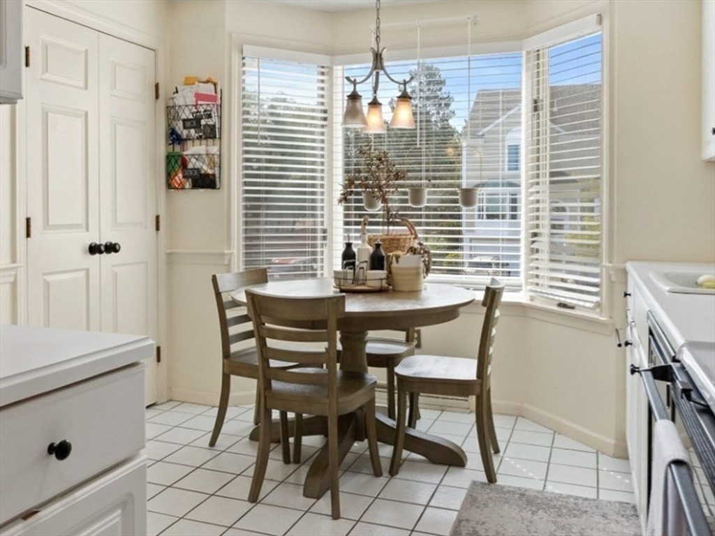 108 Abington Road, Unit 108 Danvers, MA 01923 - Photo 2 of 34 a dining room with furniture and window