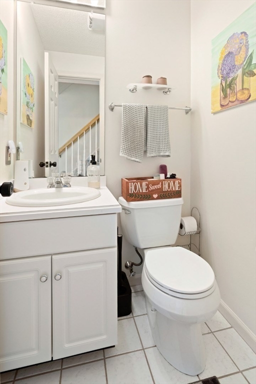 108 Abington Road, Unit 108 Danvers, MA 01923 - Photo 23 of 34 a bathroom with a toilet sink and mirror