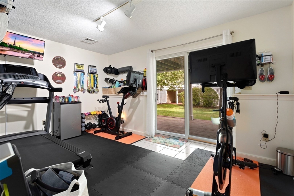 108 Abington Road, Unit 108 Danvers, MA 01923 - Photo 28 of 34 a view of a room with gym equipment