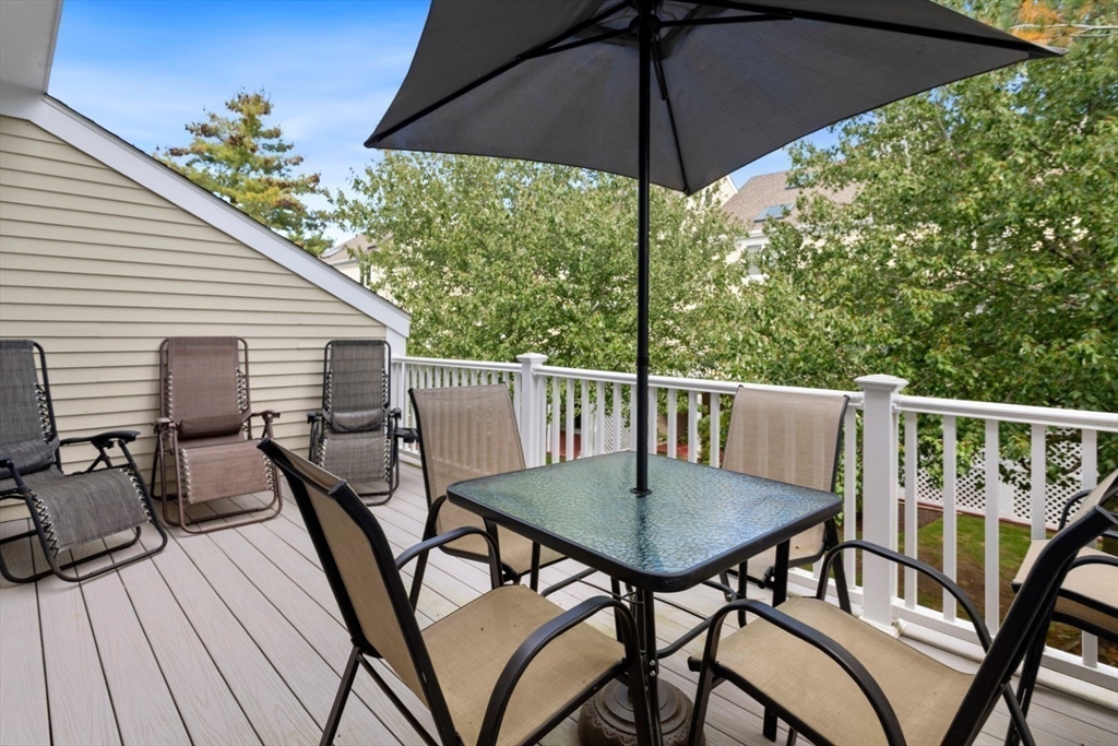 108 Abington Road, Unit 108 Danvers, MA 01923 - Photo 29 of 34 a view of balcony with table and chairs