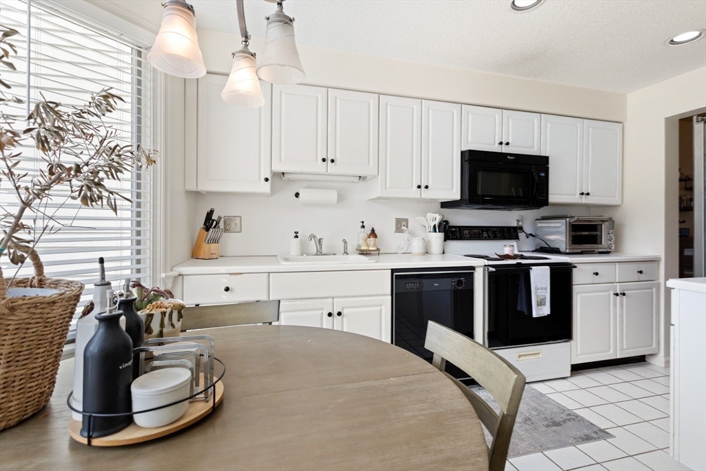 108 Abington Road, Unit 108 Danvers, MA 01923 - Photo 3 of 34 a kitchen with a appliances and cabinets