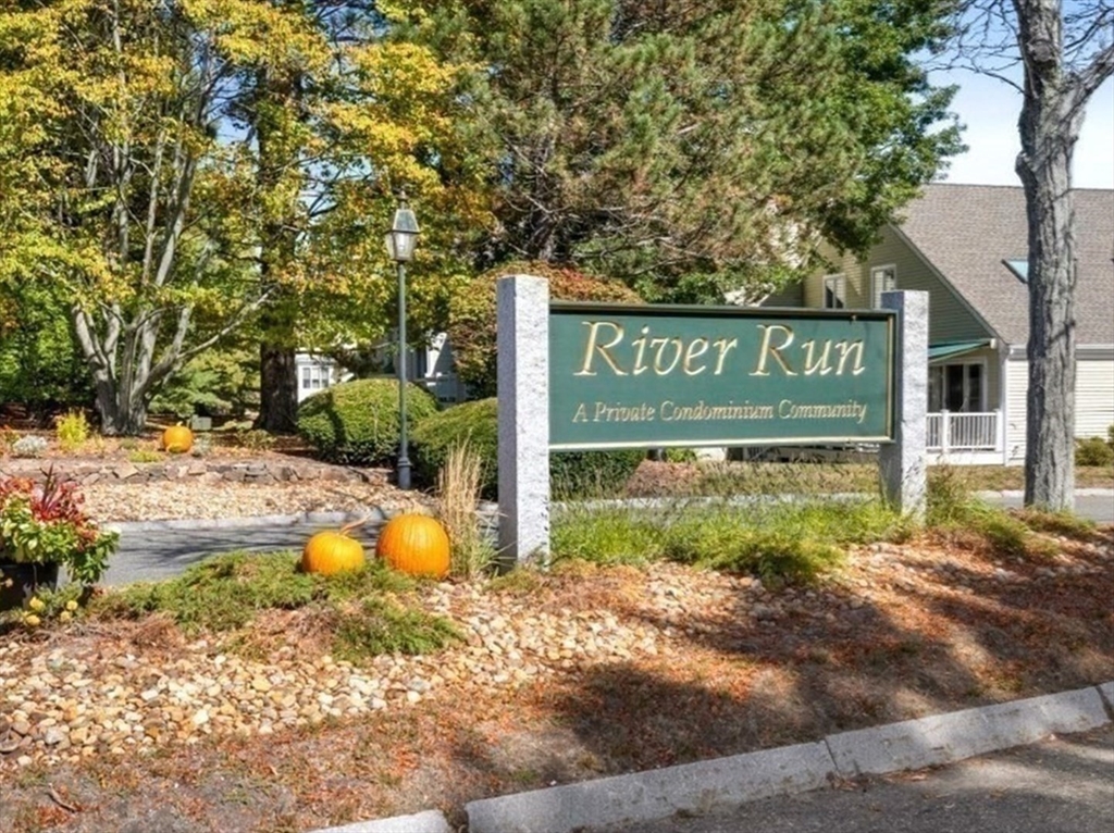 108 Abington Road, Unit 108 Danvers, MA 01923 - Photo 6 of 34 a sign of golf club on a wall
