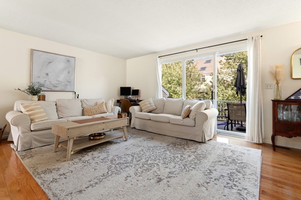 108 Abington Road, Unit 108 Danvers, MA 01923 - Photo 8 of 34 a living room with furniture and a large window