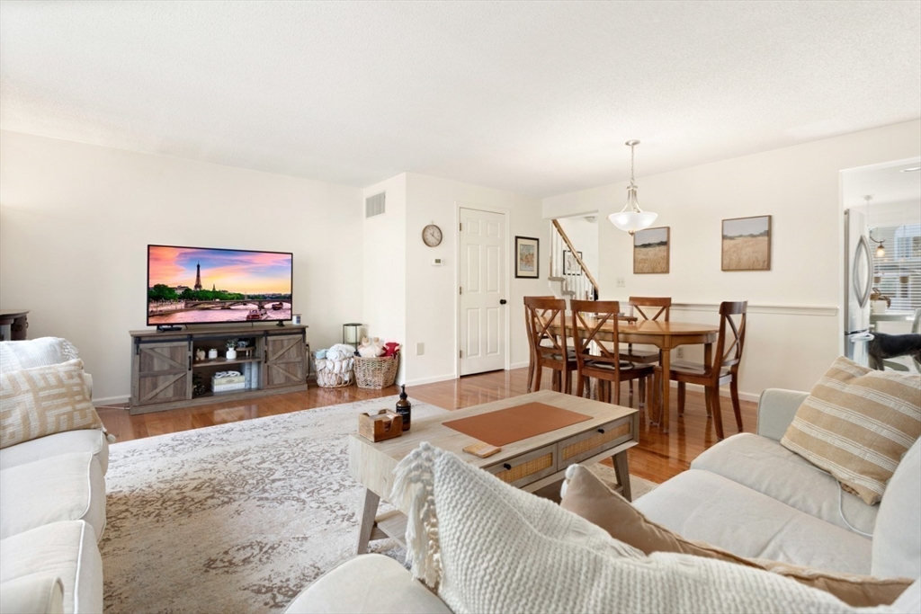 108 Abington Road, Unit 108 Danvers, MA 01923 - Photo 9 of 34 a living room with furniture and a flat screen tv