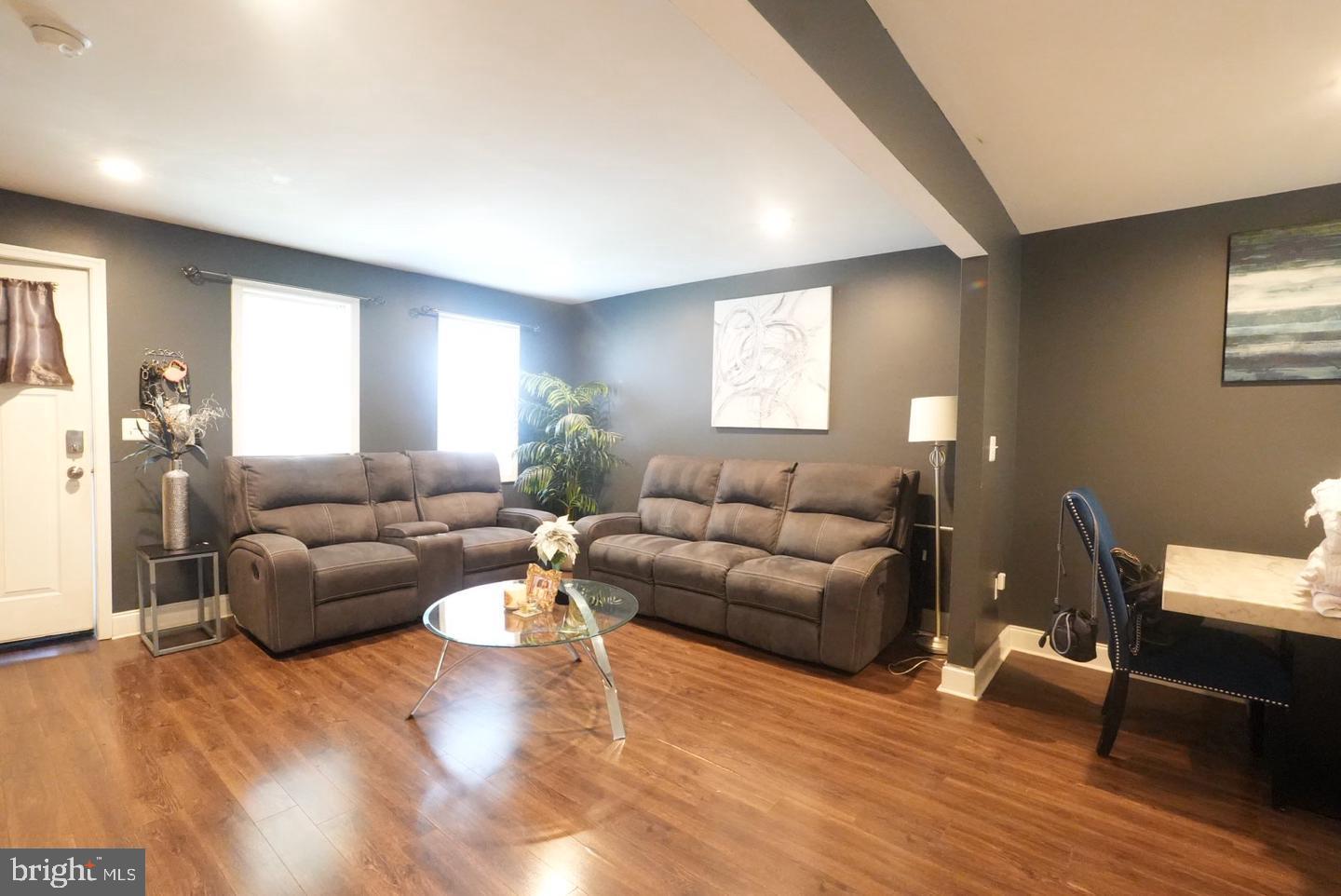 3915 Flowerton Road Baltimore, MD 21229 - Photo 6 of 15 a living room with furniture and a wooden floor