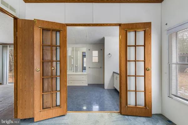 a view of an entryway with wooden floor