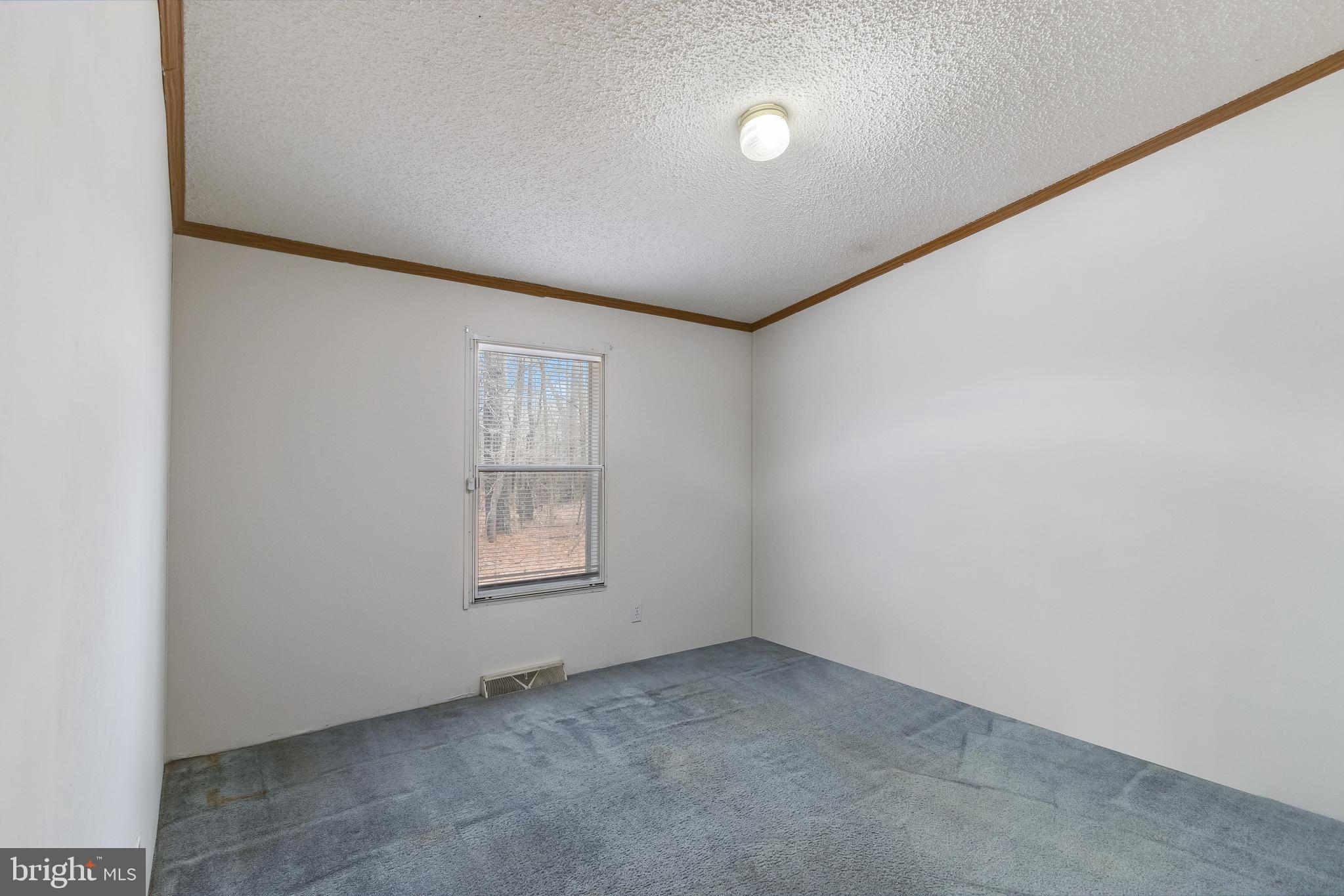 2578 Williamsville Road Houston, DE 19954 - Photo 27 of 52 an empty room with windows
