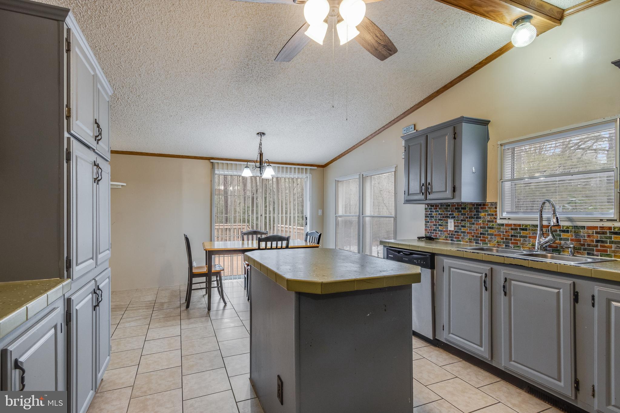 2578 Williamsville Road Houston, DE 19954 - Photo 37 of 52 a kitchen with lots of counter top space and dining table