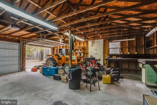 a view of empty room with wooden walls