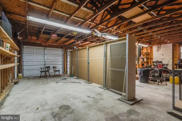 a view of a house with yard and sitting area