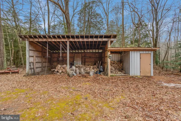 a view of a house with a snow in the yard