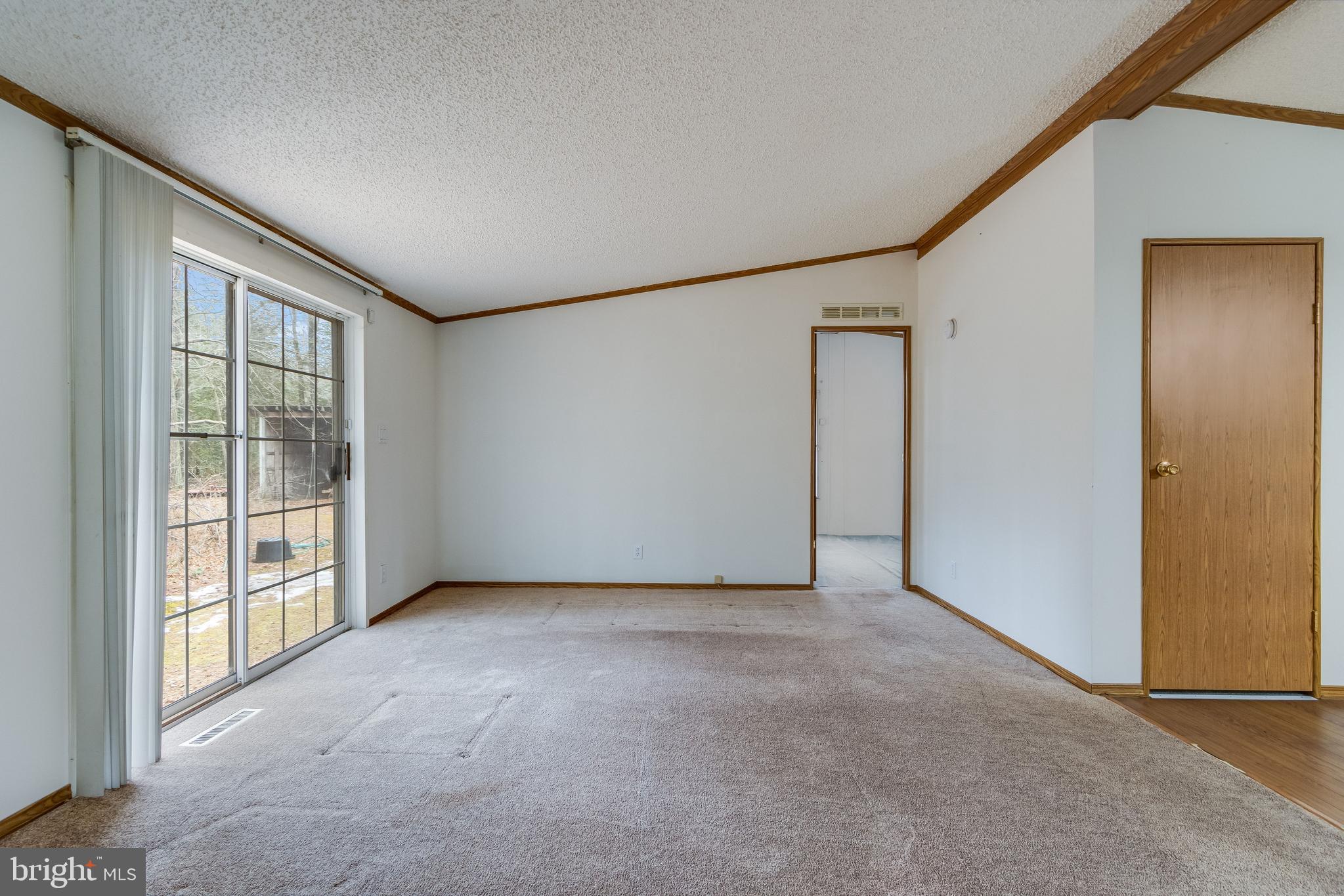 2578 Williamsville Road Houston, DE 19954 - Photo 9 of 52 an empty room with windows
