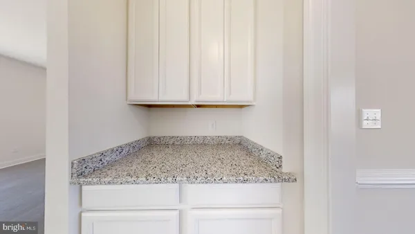 a kitchen with stainless steel appliances a refrigerator and a stove top oven