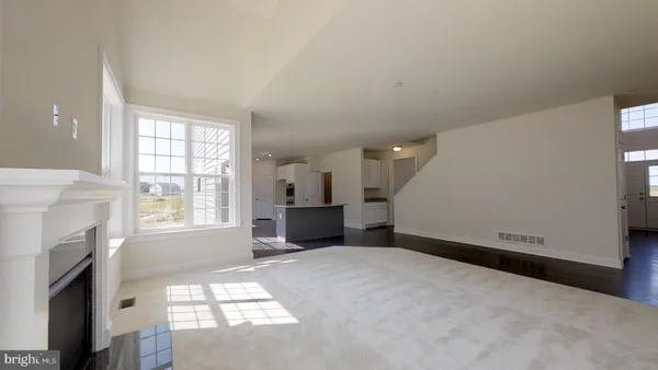 a view of staircase with white walls and windows