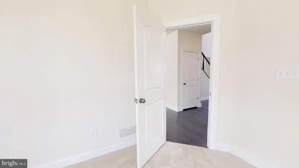 a view of a hallway with stairs